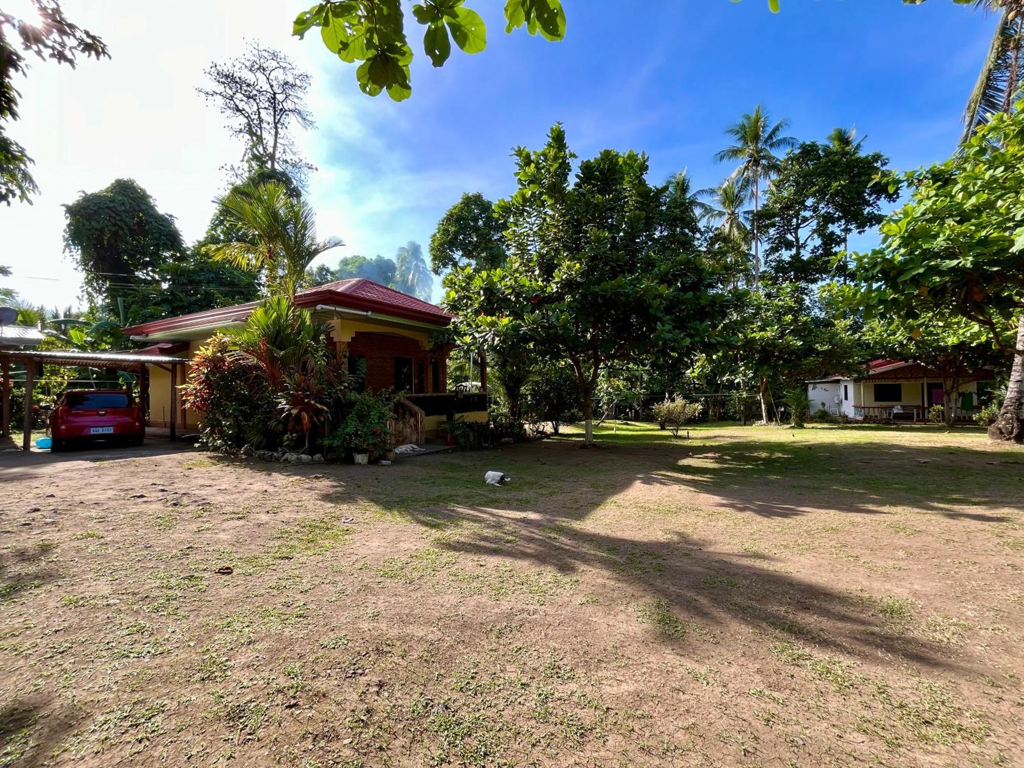 Paco'S Garden Home Stay Мамбахао Екстер'єр фото